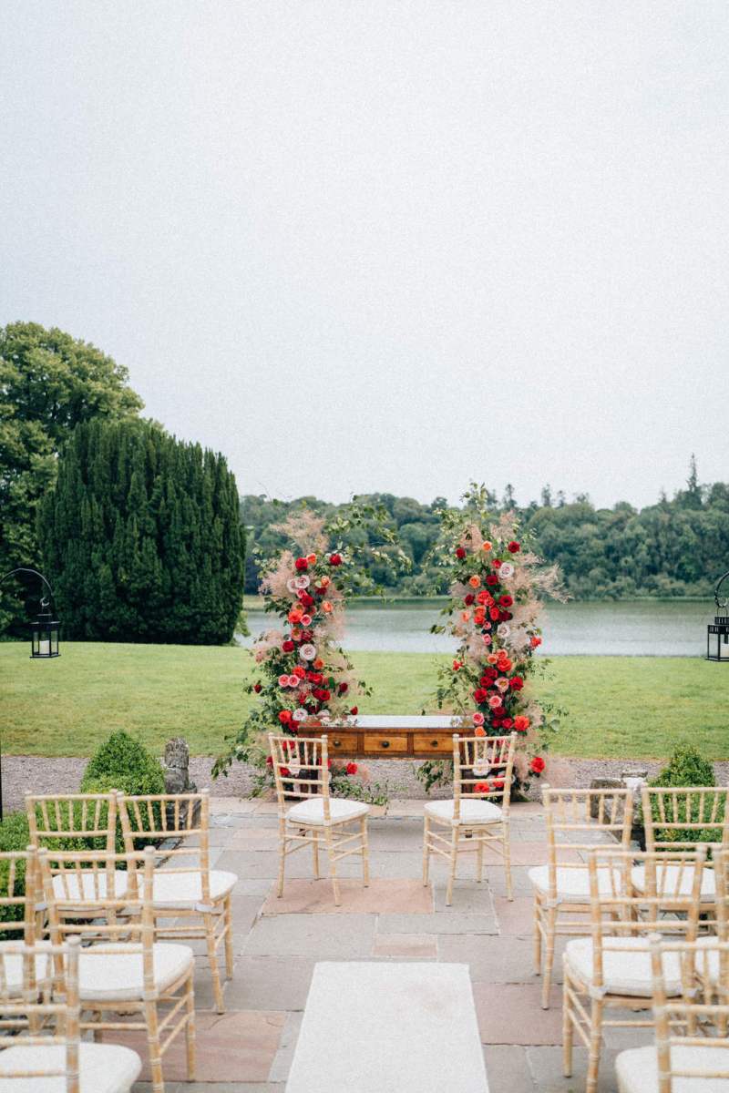 Empty ceremonial setting with flowers at alter