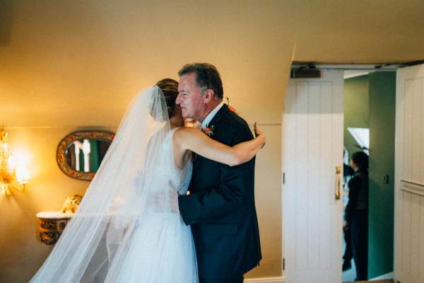 Father hugs daughter emotional moment