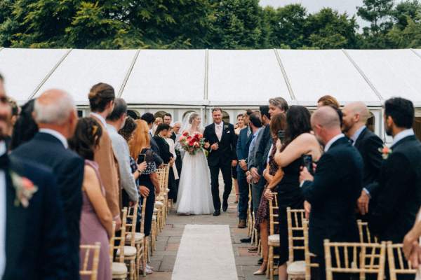 Father of the bride walks down the aisle