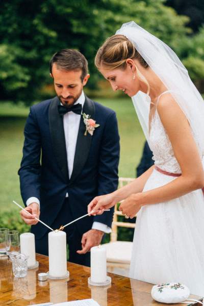 Bride and groom light the candles at ceremony