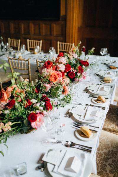 Bread baguettes on table for guests and flowers on table