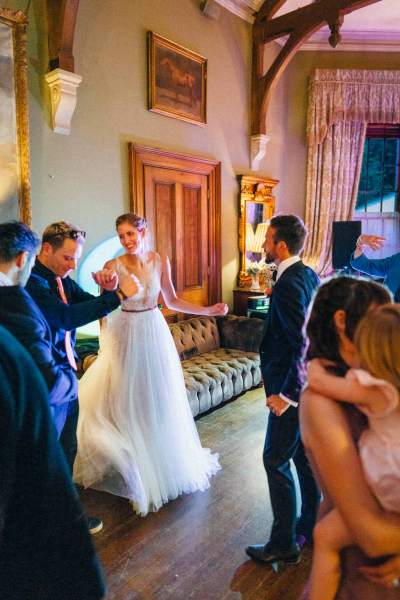 Bride groom and guests in ballroom