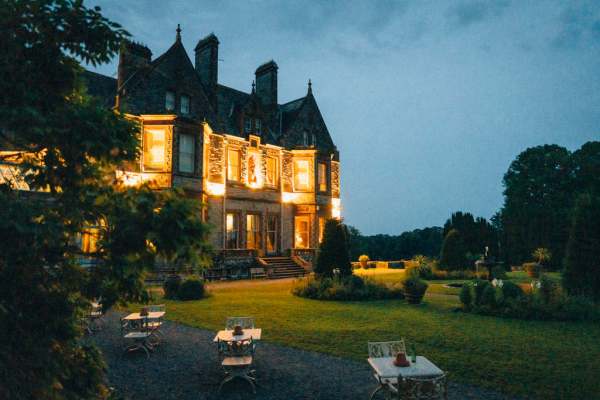 Exterior evening shot wedding venue lit up