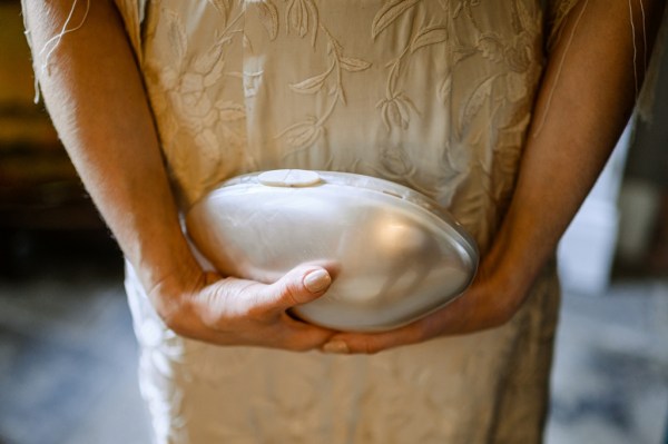 Bride holds bridal bag