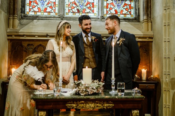 Bride groom and witnesses at table marriage certificate