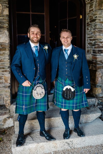 Groom and groomsman in kilts