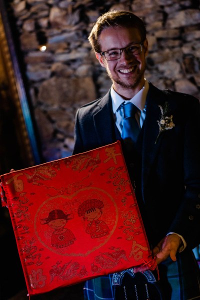 Man holding Chinese calendar