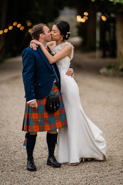 Groom picks up bride kiss kissing