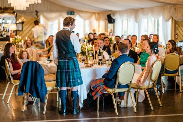 Man friend in kilt gives speech