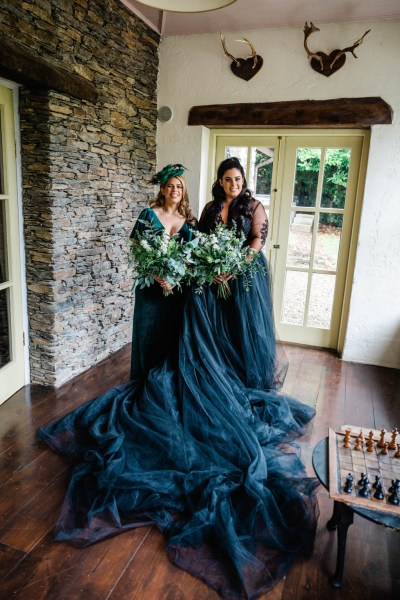 Bridesmaids pose holding flowers