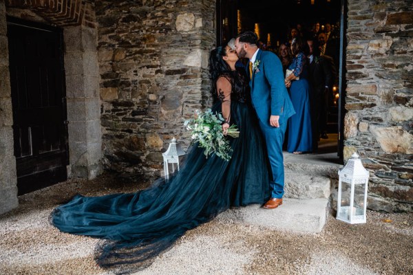 Bride and groom kiss