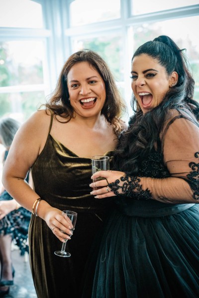 Bride and friend laughing smiling