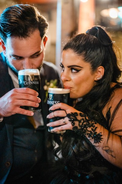 Bride and groom drink pints of Guinness