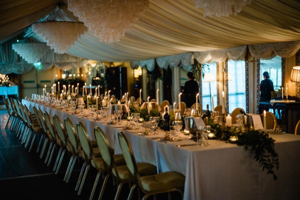 Empty dining room setting lights candles chairs and tables