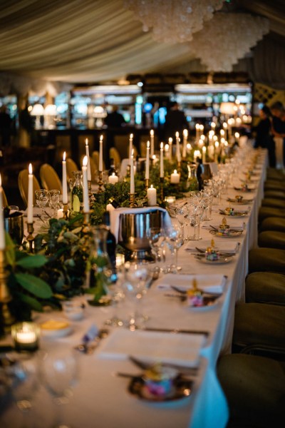 Empty dining room setting lights candles chairs and tables