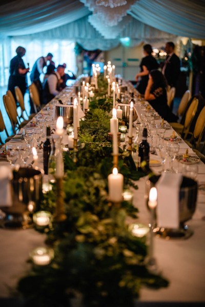 Empty dining room setting candles and guests