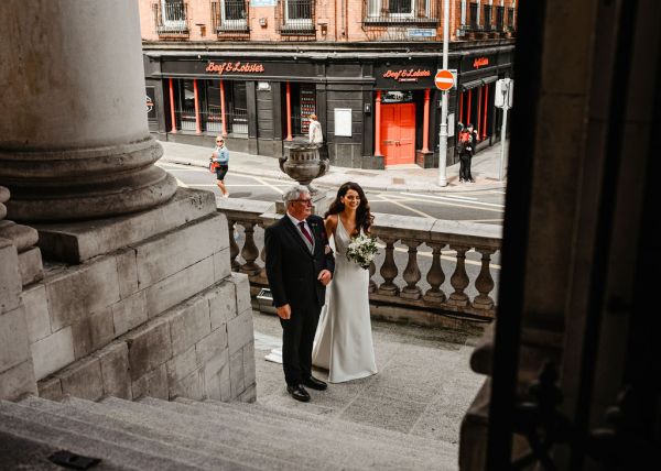 Father of the bride walks into venue together