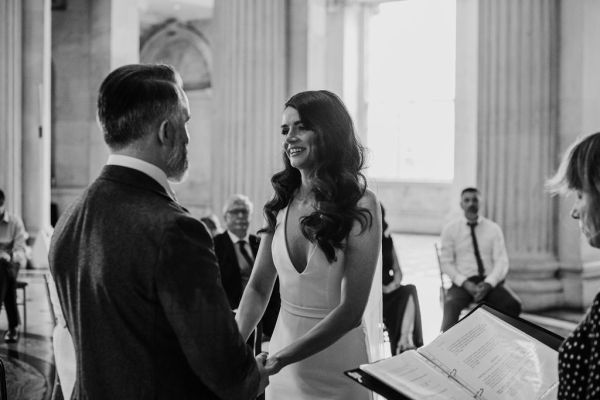 Bride and groom black and white at alter together