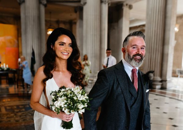 Bride and groom smile together