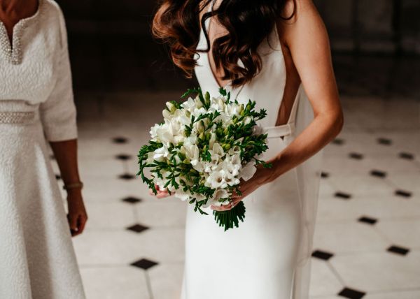 Bride holds flowers close up