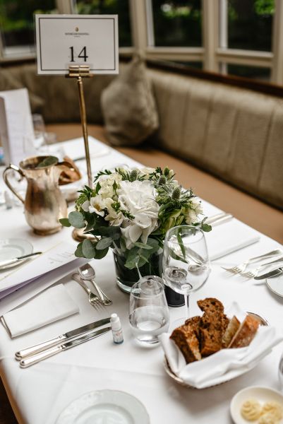 Bread on table tea milk flowers table setting