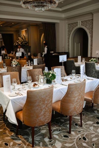 Empty dining room ballroom setting chairs and tables