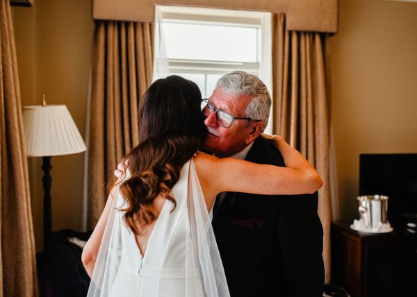 Bride hugs father