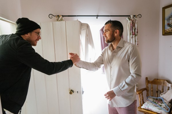 Two men shake hands getting ready