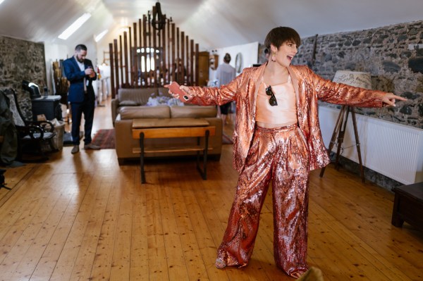 Bridesmaid in orange suit trousers