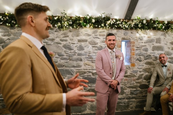 Groom and groomsman at alter