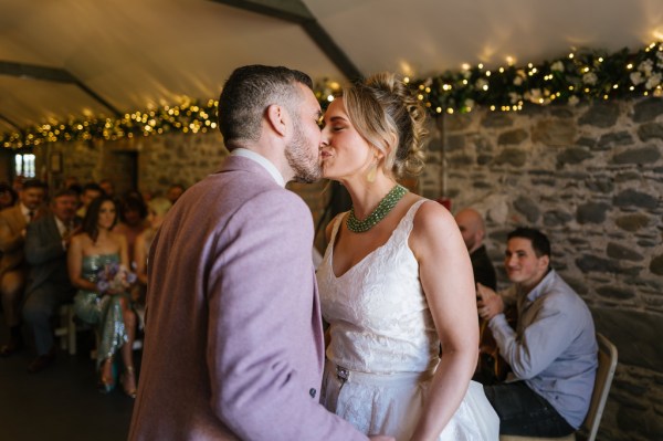 Bride and groom kiss kissing