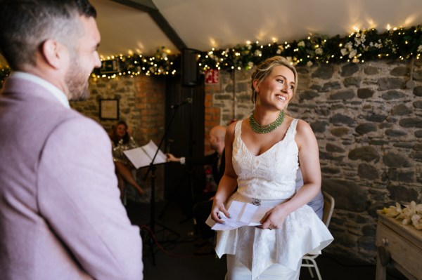 Bride reading her vows to groom