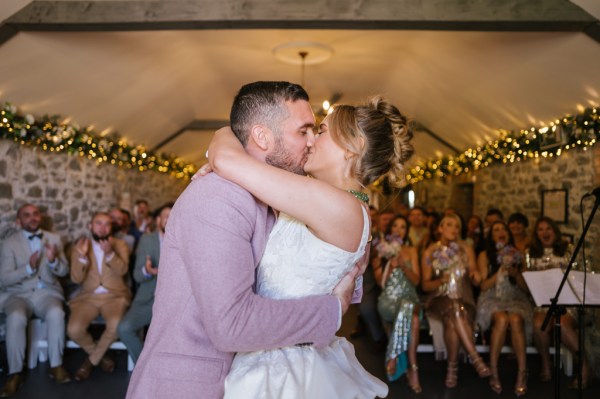 Bride and groom kiss kissing