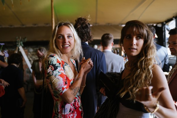 Two woman smile for the camera