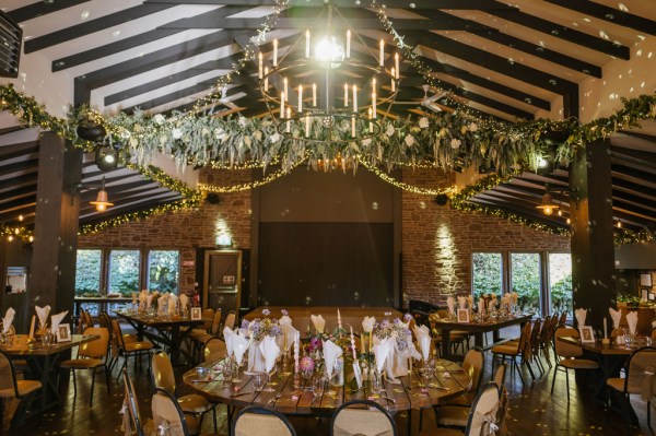 Empty dining room ballroom flowers candles and lights