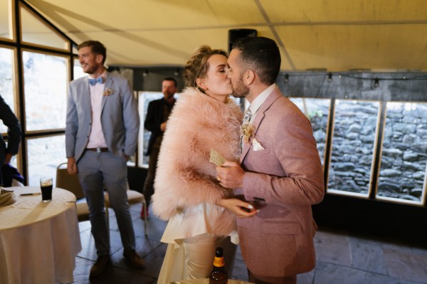 Bride and groom kiss kissing