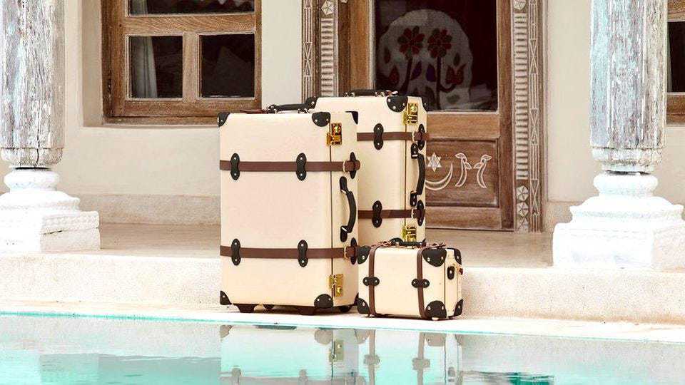 Steamline Luggage sitting beside pool in resort