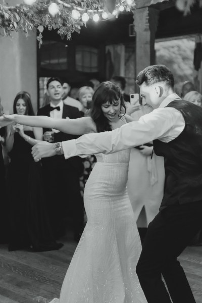 Black and white bride and groom dancing on dancefloor