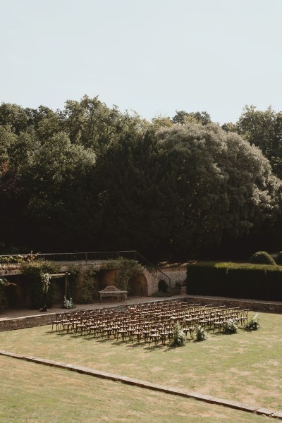 Exterior seating arrangements for guests wedding ceremony wide angle shot