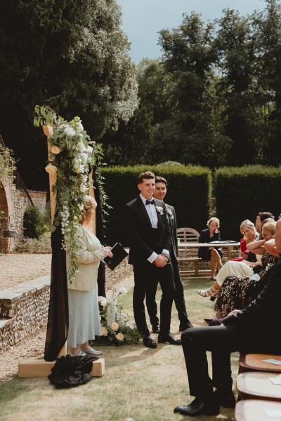 Groom waits at the alter for bride