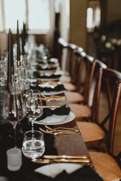 Empty dining room table cutlery and glasses