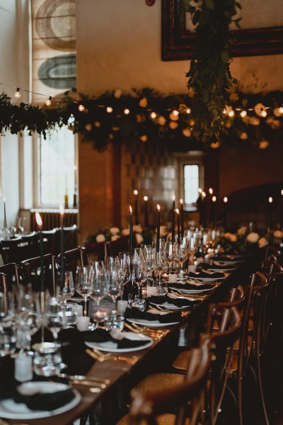 Table setting for guests lights candles and flowers