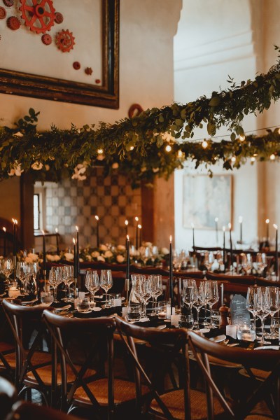 Table setting for guests lights candles and flowers