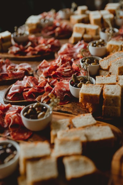 Cheese board bread olives prosciutto food