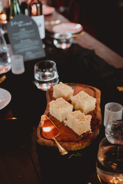 Desserts on wooden plate and glasses