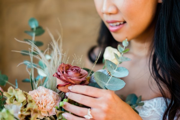 Close up of brides face makeup detail roses and flowers