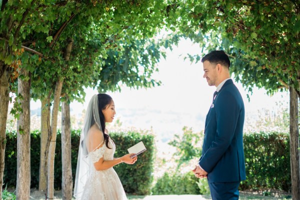 Bride reads her vows to groom