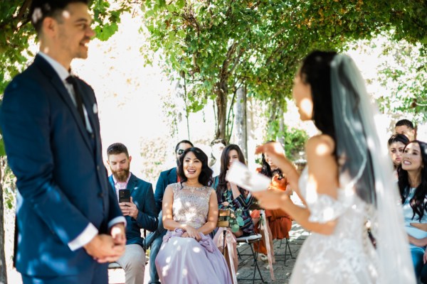 Bride reads out her vows mother in audience laughs