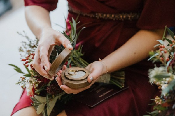 Bridesmaids opens ring box with bands