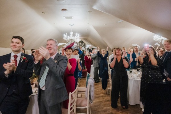 Guests clapping for the happy couple